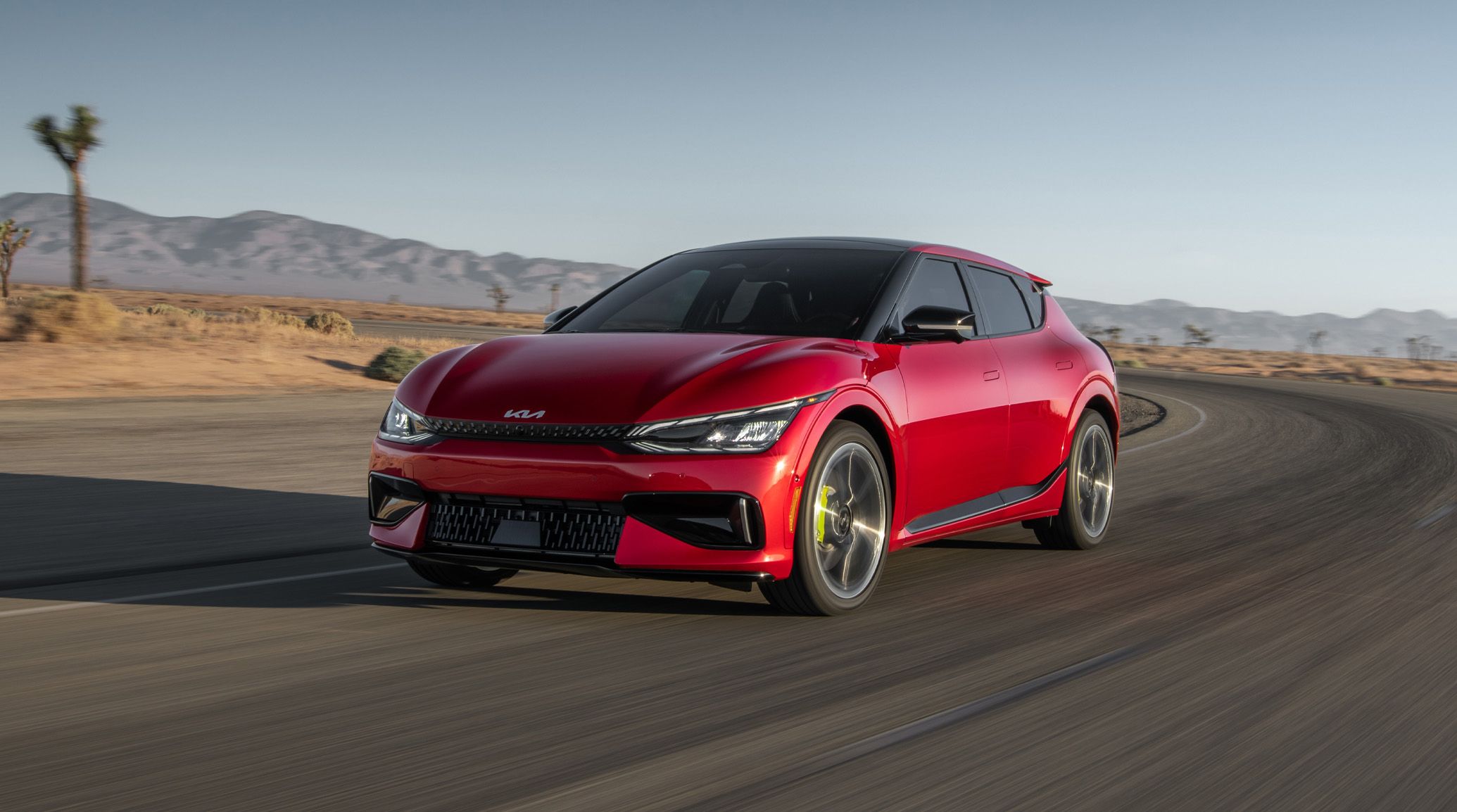 2024 Kia EV6 Accelerating Fast Through An Empty Desert Road